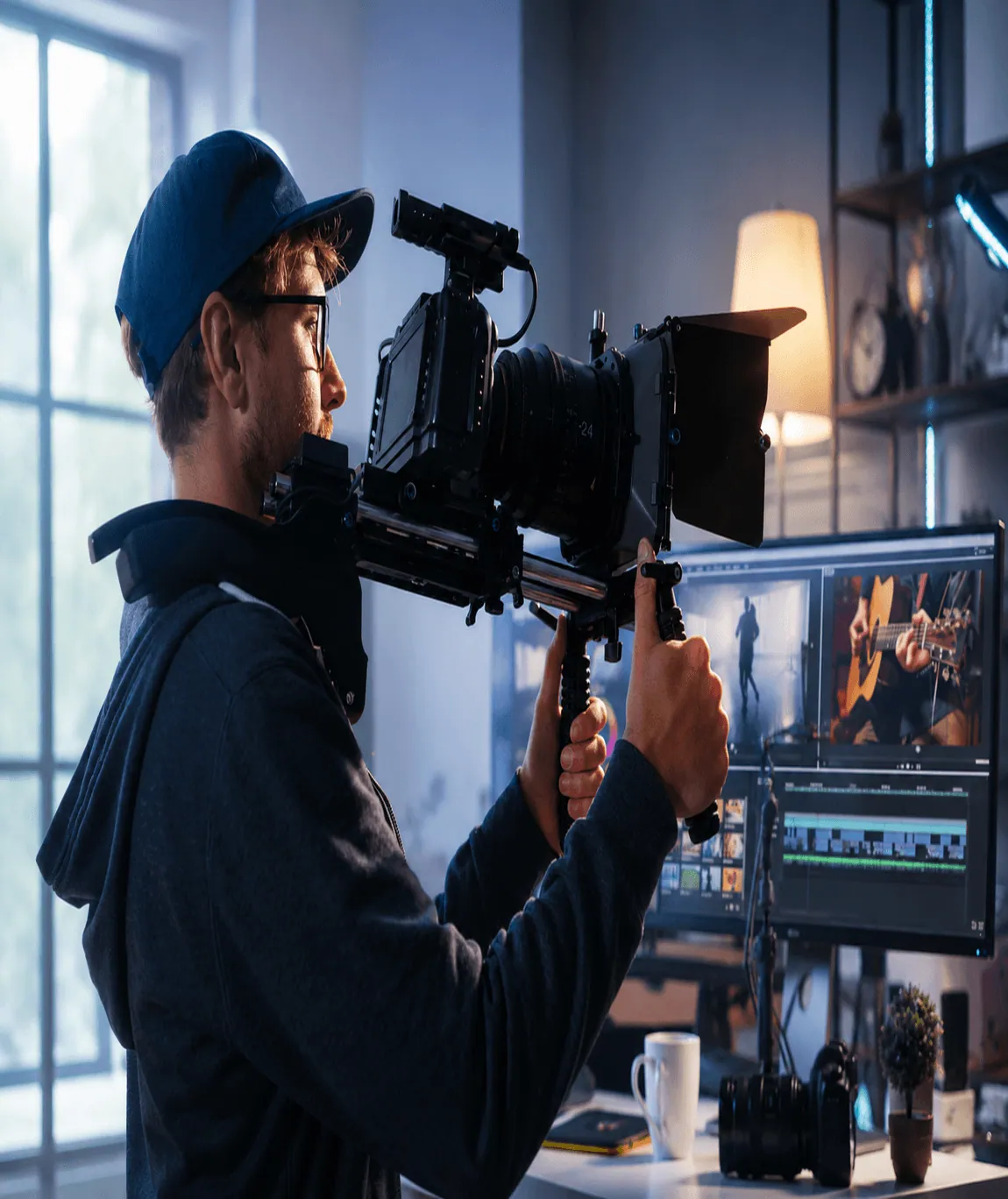 Videographer filming and editing on a monitor